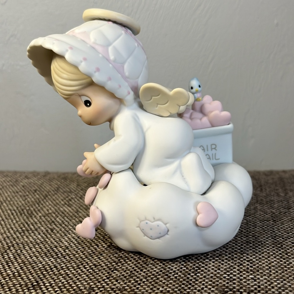 Precious Moments “Sending You My Love” figurine in original box.